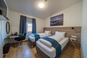 Ένα ή περισσότερα κρεβάτια σε δωμάτιο στο Guesthouse Mikael