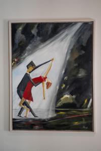 un cuadro de un hombre con un paraguas en Guesthouse Mikael, en Höfn 84 fotos más