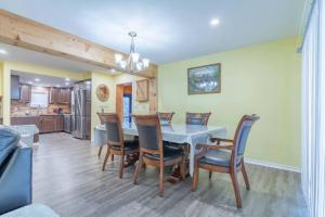 a dining room with a table and chairs at Riverview Cottage Escape in Frankford
