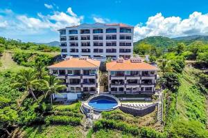 an aerial view of a large building at Beautiful Condo in Peaceful Cliffside Location with a Private Balcony & Stunning Ocean and Mountain Views in Playa Flamingo