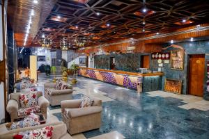 a lobby with couches and a bar in a building at Arafa Hotel - فندق عرفه الجديد in Tanta