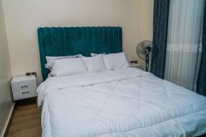 Postel nebo postele na pokoji v ubytování Urban Haven