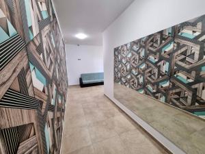 a room with a wall with a mural of a building at Flex loft in Sofia +2 photos