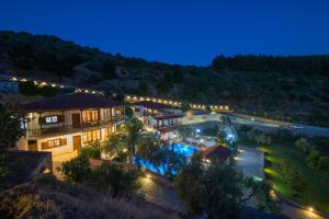 an aerial view of a mansion at night at Porto Koufo Resort in Porto Koufo