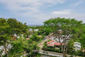 an aerial view of a town with trees at Tropical Condo with Spectacular Ocean Views, Panoramic Dining Terrace & Quick Walk to Beach in Coco