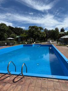 Bazén v ubytování Cabañas Ojo de Agua nebo v jeho okolí