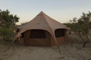 a tent sitting in the sand in the desert at Eco Glamping Biosfera - Bahia Turquesa in La Ventana