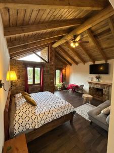 a bedroom with a bed and a living room at Cabañas villa de San Miguel in Huasca de Ocampo