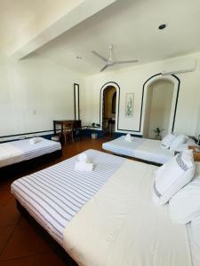 Ένα ή περισσότερα κρεβάτια σε δωμάτιο στο Hotel Tulum Centro, Party Hotel