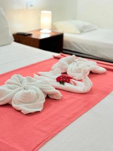 Una cama o camas en una habitación de Pousada Calamarina