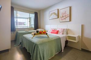 Ένα ή περισσότερα κρεβάτια σε δωμάτιο στο ITNC024- Apê com 4 quartos na Av. Atlântica de BC +70 φωτογραφίες