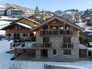 a large house with snow on the ground at Chalet spacieux avec bain nordique et hammam à Saint-Martin-de-Belleville - FR-1-570-66 in Saint-Martin-de-Belleville