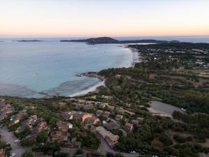 an aerial view of a beach with houses and the ocean at Dimora Su Tramonti a due passi dal mare! in Is Traias +58 photos