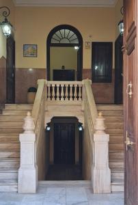 a set of stairs in a house with a door at Marvelous flat in the city center in Ceuta