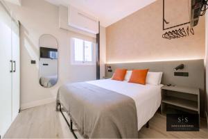 Postel nebo postele na pokoji v ubytování Santa Sofia Suites