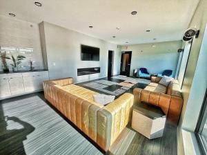 a living room with a couch and a table at Monochrome Den in Des Moines