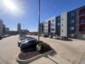 a parking lot with a row of parked cars at Graphite Loft in Des Moines
