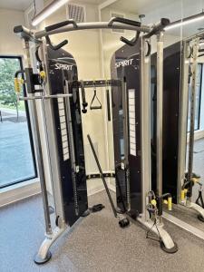 a gym with several treadmills and machines in it at Indigo Studio in Des Moines +15 photos