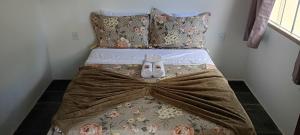 En eller flere senge i et værelse på Flats dos Fernandes Geribá