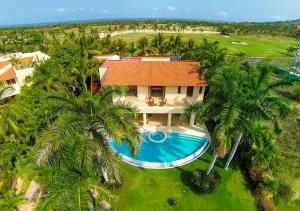 an aerial view of a house with a swimming pool and palm trees at Ocean view villa- home Infinity Pool Concierge in Punta Mita