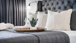 a tray with a plant sitting on a bed at Inn at Seacrest Beach 408 in Rosemary Beach
