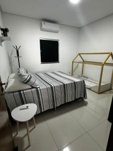 Ένα ή περισσότερα κρεβάτια σε δωμάτιο στο HOME 111 - Casa completa em Petrolina