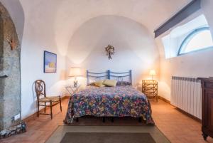 Ένα ή περισσότερα κρεβάτια σε δωμάτιο στο Borgo Rinascimento