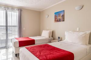 Ένα ή περισσότερα κρεβάτια σε δωμάτιο στο Hotel Veas