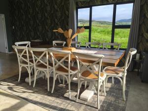 a dining room table and chairs with a view at Beautiful Breakaway in Champagne Valley