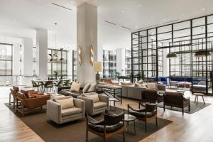 a lobby with a lot of chairs and tables at Kimpton Everly Hotel Hollywood by IHG in Los Angeles
