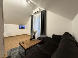 Posezení v ubytování Centro apartamentai