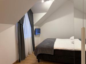 Postel nebo postele na pokoji v ubytování Centro apartamentai