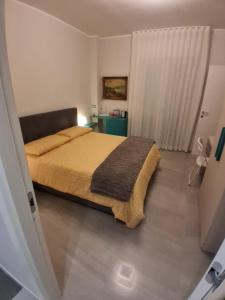 En eller flere senge i et værelse på Bellavista Trani Rooms