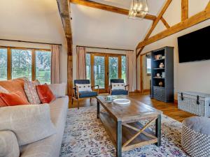 a living room with a couch and a table at 1 Bed in Leominster 95609 in Pencombe