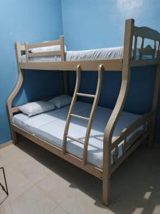 Ένα ή περισσότερα κρεβάτια σε δωμάτιο στο Departamento Comuna San José