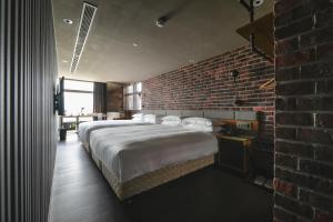Postel nebo postele na pokoji v ubytování City Suites - Kaohsiung Pier2