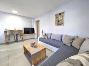 a living room with a couch and a table at Aeolus Apartment I in Galaxidi