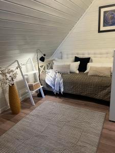 Ένα ή περισσότερα κρεβάτια σε δωμάτιο στο Rønningen Panorama