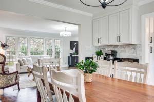 a kitchen and living room with a table and chairs at Explore Cleveland Attractions! Family-Focused Home in Beachwood