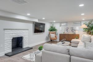 a living room with a couch and a fireplace at Explore Cleveland Attractions! Family-Focused Home in Beachwood