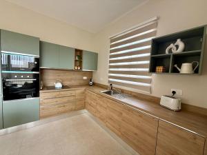 Η κουζίνα ή μικρή κουζίνα στο AS3 - The Alley Suites Apartment in Gudja +8 φωτογραφίες