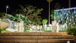 a set of stairs in a park at night at Hotel Caparena in Taormina