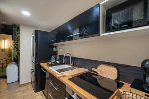 Kuchyň nebo kuchyňský kout v ubytování Thermo'Spa - Gîte Spa Privatif + 11 fotografií