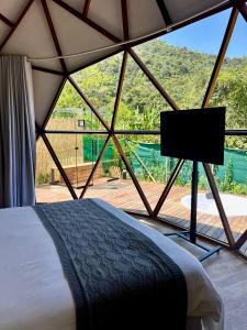 Voodi või voodid majutusasutuse Cabana da Lua - Sua melhor experiência em um domo toas