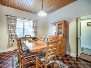 a dining room with a wooden table and chairs at 3 Bed in Bruree oc-i207 in Brú Rí