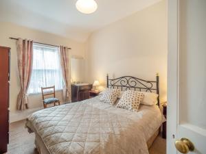 a bedroom with a large bed and a window at 3 Bed in Bruree oc-i207 in Brú Rí