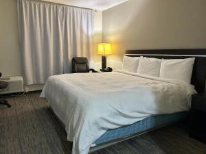 Ένα ή περισσότερα κρεβάτια σε δωμάτιο στο Gateaway Motel Broken Bow NE