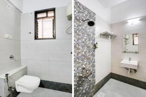 a bathroom with a toilet and a sink at Super Hotel O Nashik Road Formerly The Address Hotel in Nashik