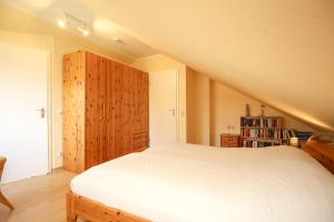 Postel nebo postele na pokoji v ubytování Urlauberdorf Haus 60c