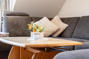 Posezení v ubytování Ferienpark Freesenbruch Wohnung 3 4 - Zum Zeesenboot